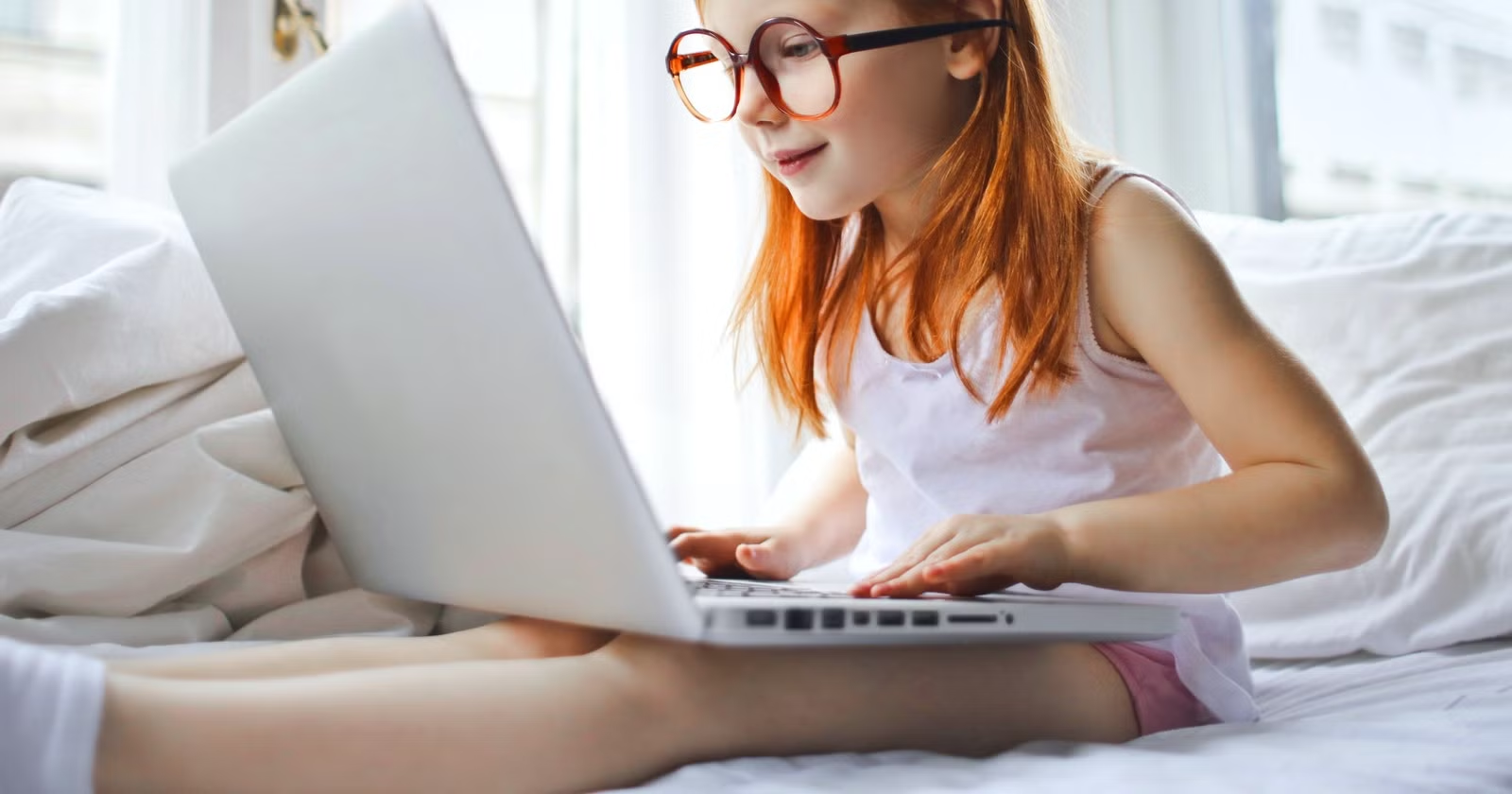 Kid with Laptop on Lap - Reading Apps for Kids