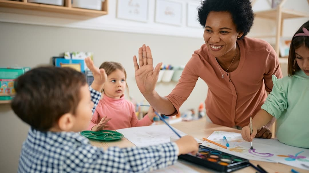 Teacher High Fiving - Preschool Age Range