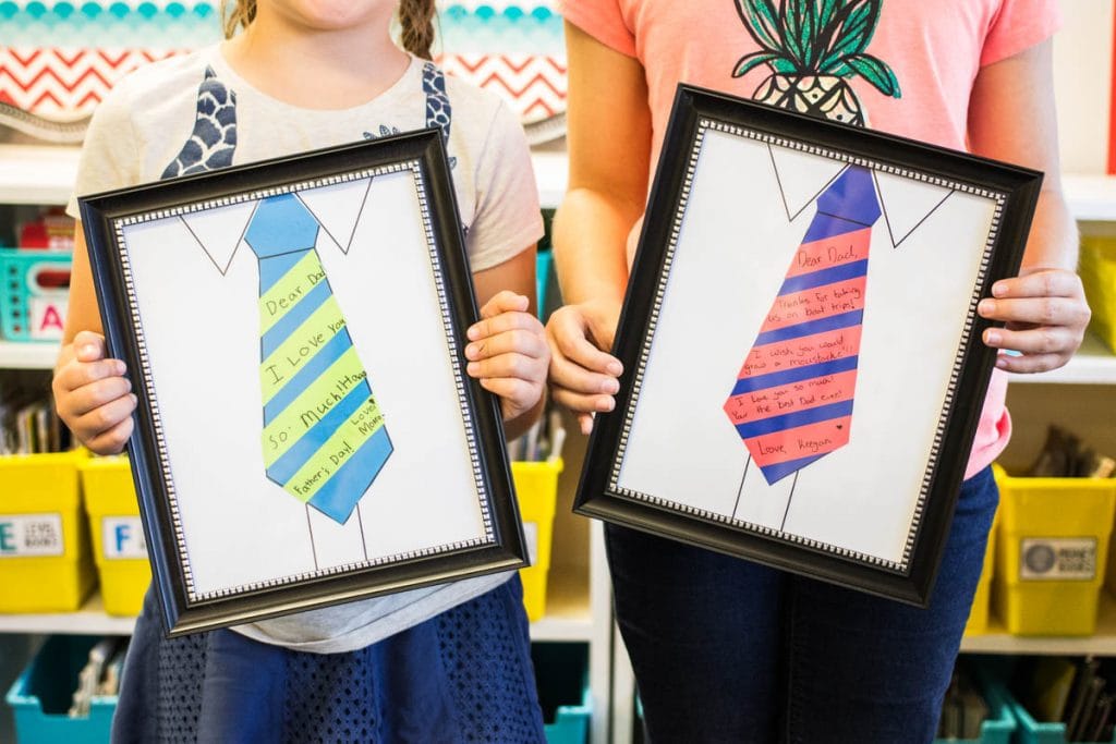 Kids Holding Portraits - Father's Day crafts preschool