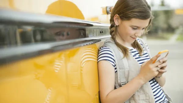 Kid with phone - List of Websites to Block for Kids