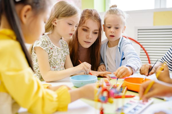 Teacher Guiding Students - How Much Is Preschool